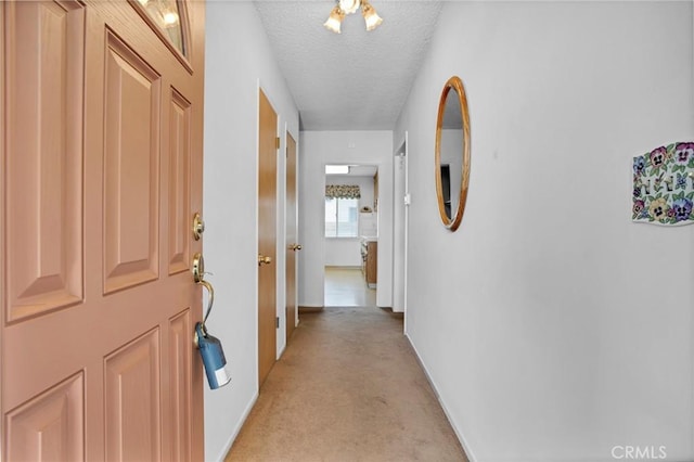 18944 Prairie St, Northridge, CA 91324 - corridor with light colored carpet and a textured ceiling