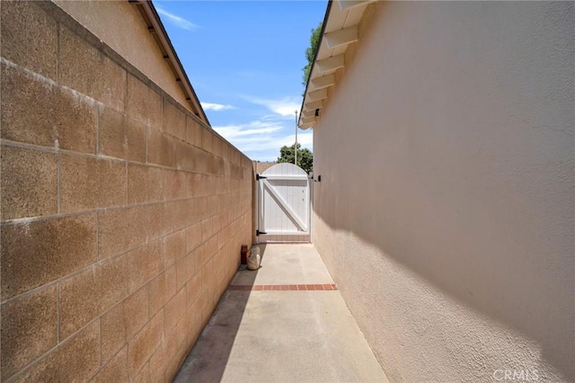 18944 Prairie St, Northridge, CA 91324 - view of side of property featuring a gate and stucco siding
