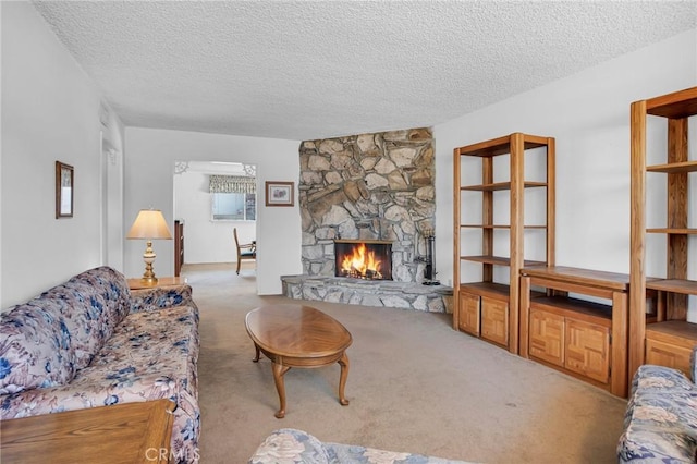 18944 Prairie St, Northridge, CA 91324 - living room featuring a textured ceiling, carpet floors, and a fireplace