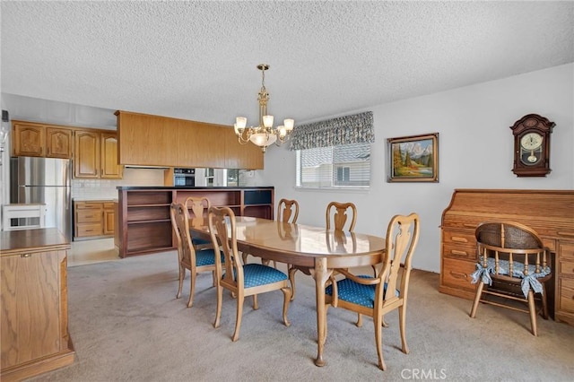 18944 Prairie St, Northridge, CA 91324 - dining area featuring a chandelier, light carpet, and a textured ceiling