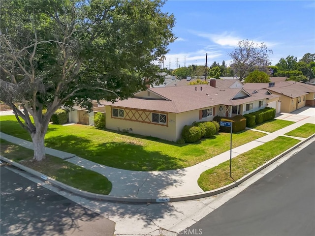 18944 Prairie St, Northridge, CA 91324 - ranch-style home featuring a front yard, stucco siding, and a shingled roof