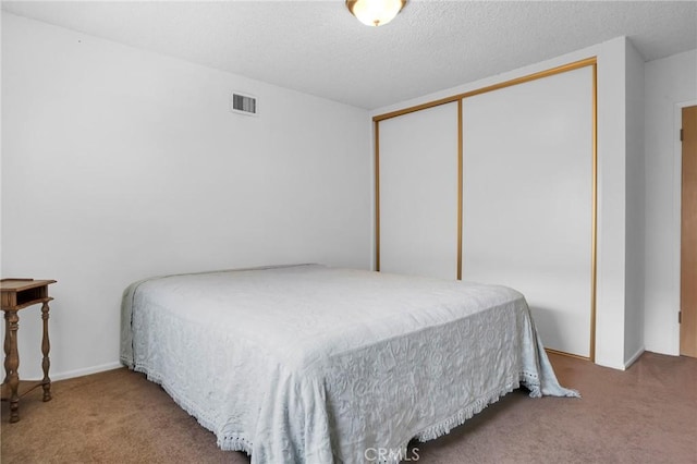 18944 Prairie St, Northridge, CA 91324 - carpeted bedroom with a closet and a textured ceiling