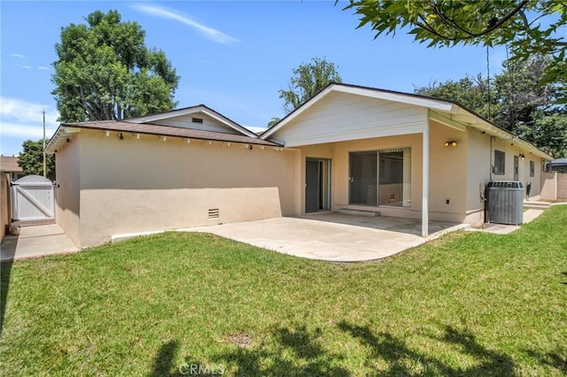 18944 Prairie St, Northridge, CA 91324 - rear view of property featuring a gate, stucco siding, a patio area, and a yard