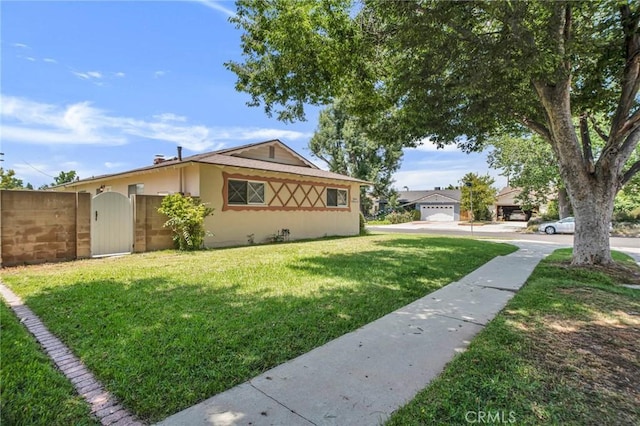 18944 Prairie St, Northridge, CA 91324 - view of front facade with a gate and stucco siding