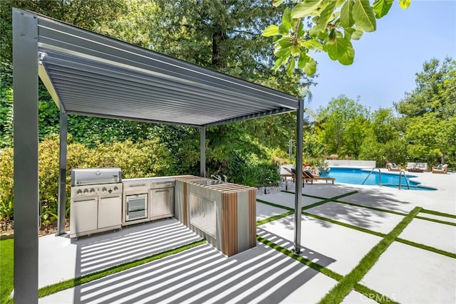 20101 Greenbriar Dr, Tarzana, CA 91356 - view of patio / terrace featuring exterior kitchen, an outdoor pool, and view of scattered trees