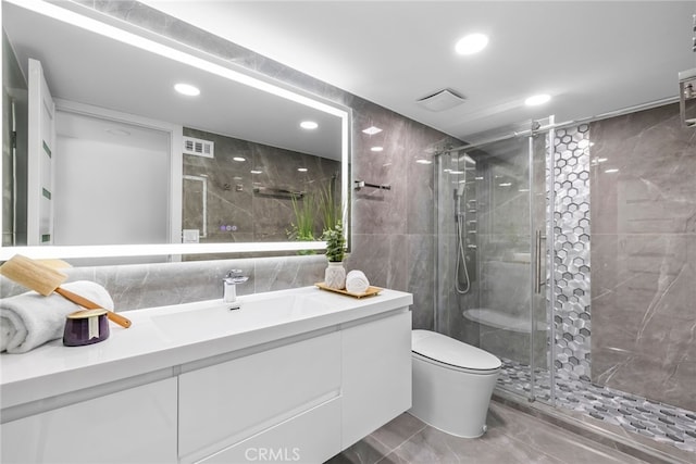 20101 Greenbriar Dr, Tarzana, CA 91356 - bathroom with vanity, a shower stall, recessed lighting, tile walls, and marble finish flooring
