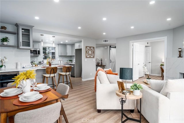 3401 E Wilton St Unit 204, Long Beach, CA 90804 - living room with wine cooler, recessed lighting, and light wood-style flooring