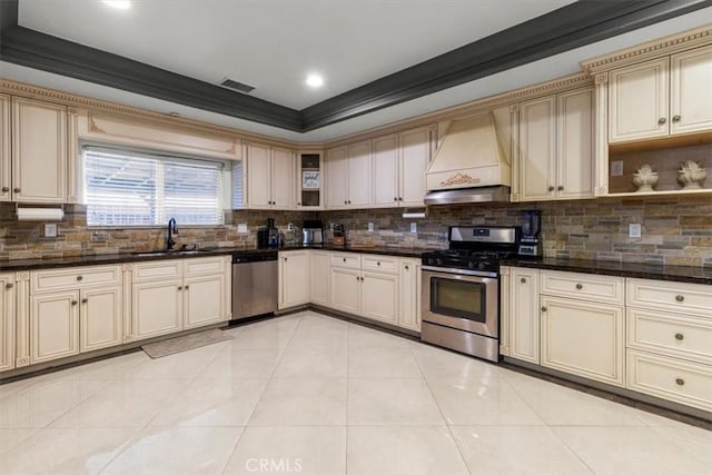 17635 Verde St, Hesperia, CA 92345 - kitchen featuring stainless steel appliances, custom exhaust hood, cream cabinetry, light tile patterned floors, and open shelves
