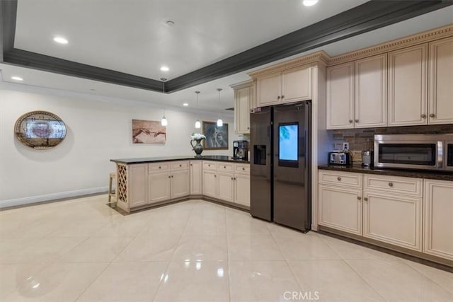 17635 Verde St, Hesperia, CA 92345 - kitchen featuring fridge with ice dispenser, stainless steel microwave, a peninsula, cream cabinets, and ornamental molding