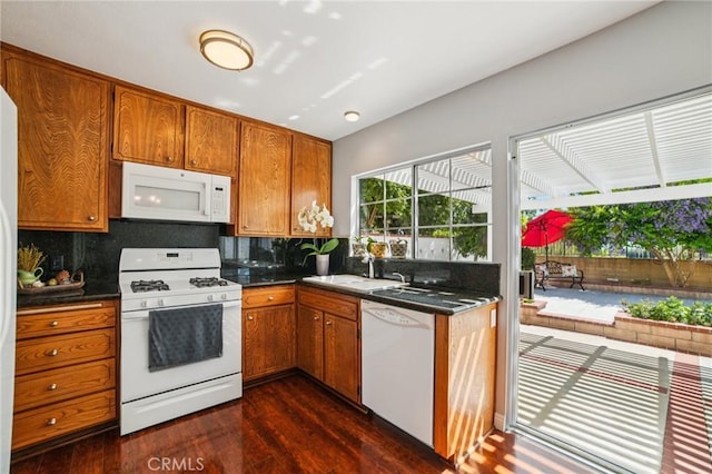23441 Via Ronda, Mission Viejo, CA 92691 - kitchen with white appliances, brown cabinets, and dark countertops