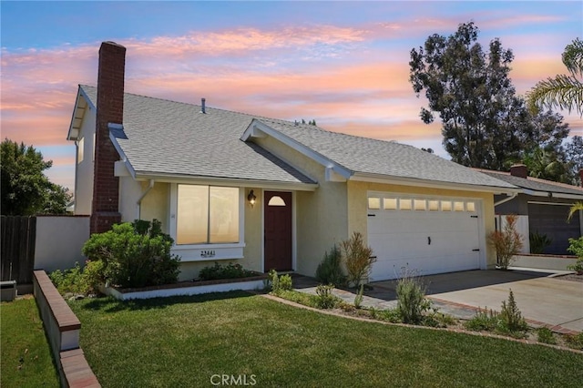 23441 Via Ronda, Mission Viejo, CA 92691 - view of front facade with a garage, concrete driveway, stucco siding, and a chimney