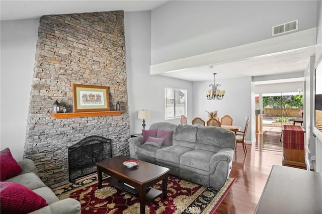 23441 Via Ronda, Mission Viejo, CA 92691 - living area with wood finished floors, a chandelier, a fireplace, and a towering ceiling