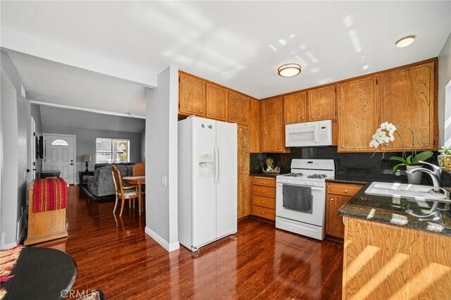 23441 Via Ronda, Mission Viejo, CA 92691 - kitchen featuring white appliances, brown cabinets, dark wood-type flooring, and tasteful backsplash