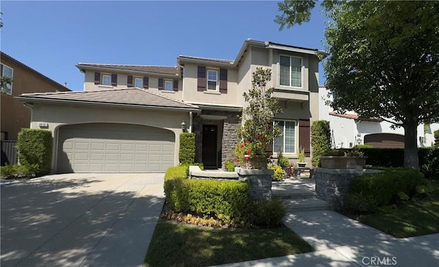 28107 Graciosa St, Valencia, CA 91355 - traditional-style home featuring a garage, stucco siding, and concrete driveway