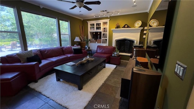 28107 Graciosa St, Valencia, CA 91355 - living room featuring a ceiling fan, a fireplace, crown molding, and track lighting