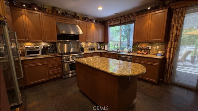 28107 Graciosa St, Valencia, CA 91355 - kitchen with under cabinet range hood, appliances with stainless steel finishes, backsplash, and recessed lighting
