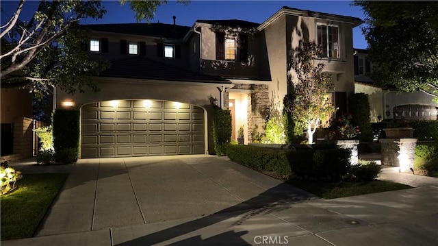 28107 Graciosa St, Valencia, CA 91355 - view of front of house with stucco siding, driveway, and an attached garage