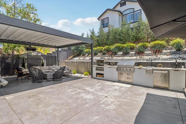 5414 Foxtail Loop, Carlsbad, CA 92010 - view of patio with exterior kitchen and an outdoor living space with a fire pit