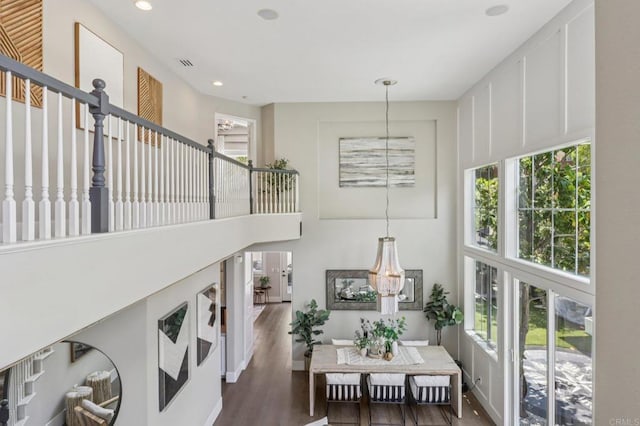 5414 Foxtail Loop, Carlsbad, CA 92010 - stairway featuring healthy amount of natural light, wood finished floors, recessed lighting, and a towering ceiling