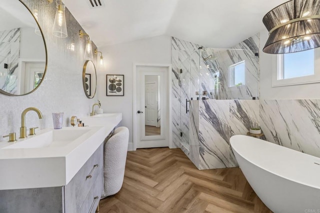 5414 Foxtail Loop, Carlsbad, CA 92010 - full bathroom featuring a freestanding tub, double vanity, a marble finish shower, vaulted ceiling, and tile walls