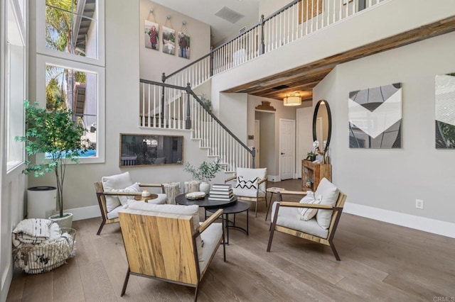 5414 Foxtail Loop, Carlsbad, CA 92010 - living room with a high ceiling, stairs, and wood finished floors