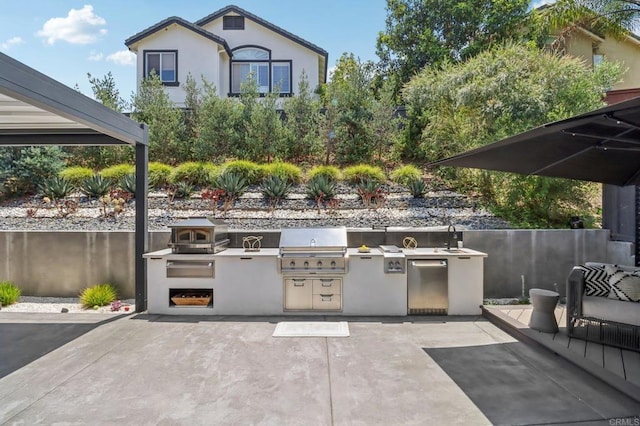 5414 Foxtail Loop, Carlsbad, CA 92010 - view of patio with an outdoor kitchen