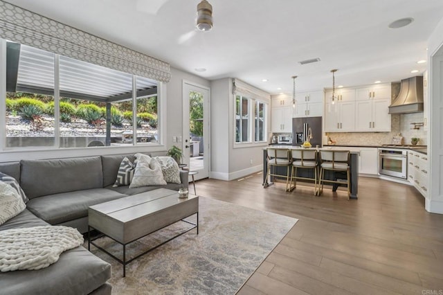 5414 Foxtail Loop, Carlsbad, CA 92010 - living area featuring dark wood-style flooring, a ceiling fan, and recessed lighting
