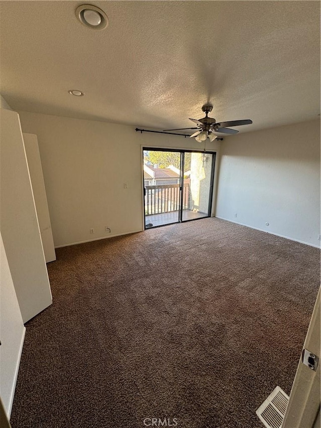 1107 Grieb Dr, Arroyo Grande, CA 93420 - unfurnished room with a ceiling fan, dark carpet, and a textured ceiling