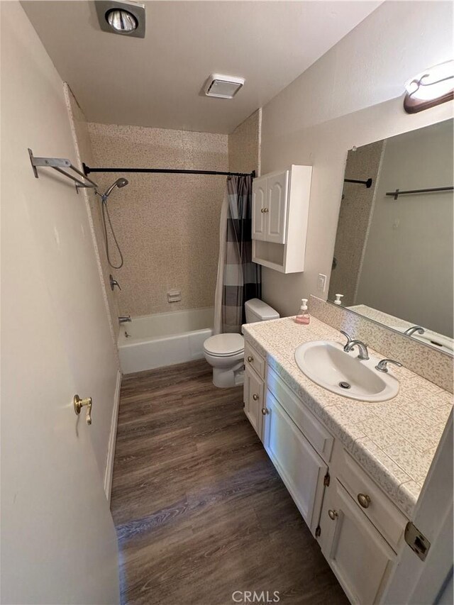 1107 Grieb Dr, Arroyo Grande, CA 93420 - bathroom with vanity, shower / bathtub combination with curtain, and wood finished floors