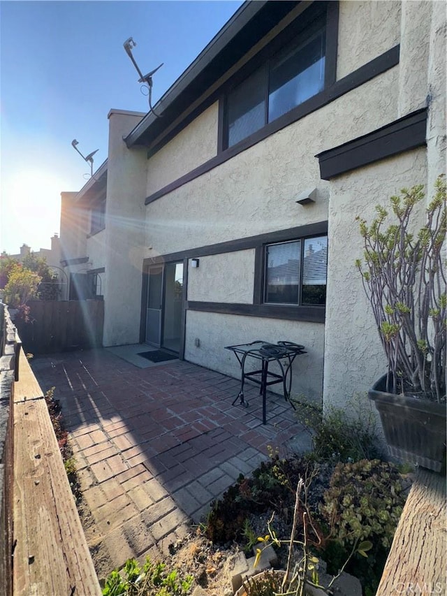 1107 Grieb Dr, Arroyo Grande, CA 93420 - rear view of house with stucco siding and a patio area
