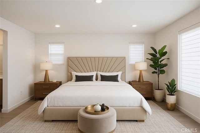 2275 Melogold Way, Corona, CA 92883 - bedroom featuring multiple windows, recessed lighting, and light wood-type flooring