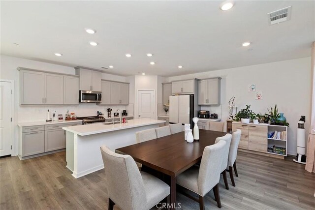 2275 Melogold Way, Corona, CA 92883 - dining area with light wood finished floors and recessed lighting