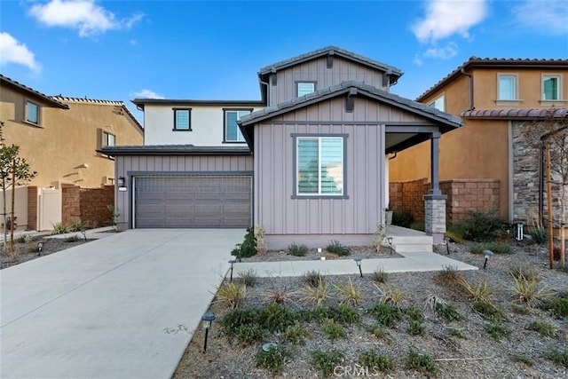 2275 Melogold Way, Corona, CA 92883 - view of front facade featuring board and batten siding, an attached garage, and driveway