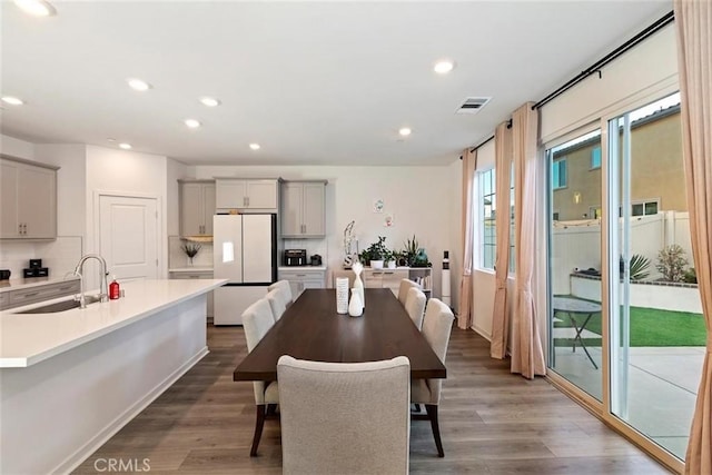 2275 Melogold Way, Corona, CA 92883 - dining space featuring wood finished floors and recessed lighting