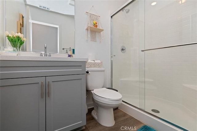 2275 Melogold Way, Corona, CA 92883 - bathroom with wood finished floors, a shower stall, and vanity
