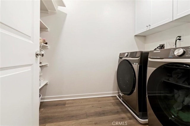 2275 Melogold Way, Corona, CA 92883 - laundry area featuring cabinet space, washer and dryer, and wood finished floors