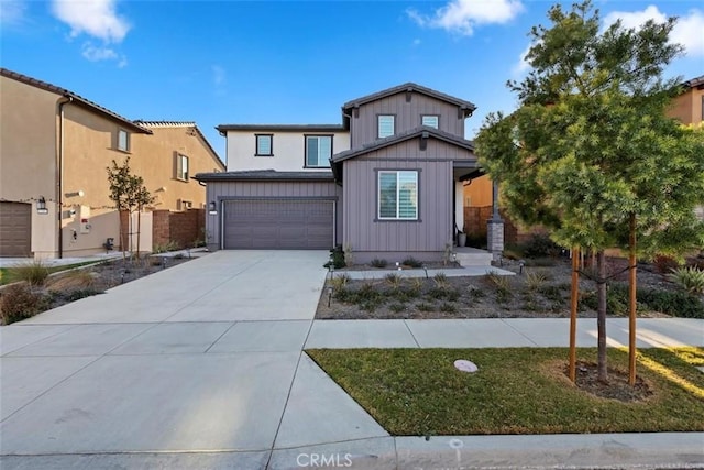 2275 Melogold Way, Corona, CA 92883 - view of front facade with a garage, driveway, and board and batten siding