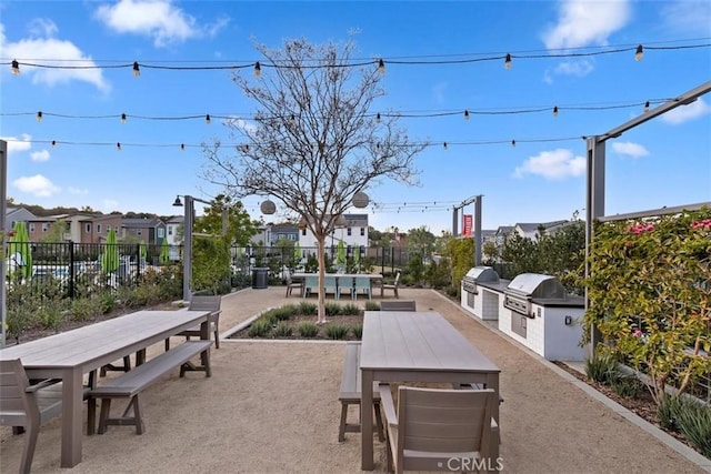 2275 Melogold Way, Corona, CA 92883 - view of home's community featuring outdoor dining space, an outdoor kitchen, a patio area, and a residential view