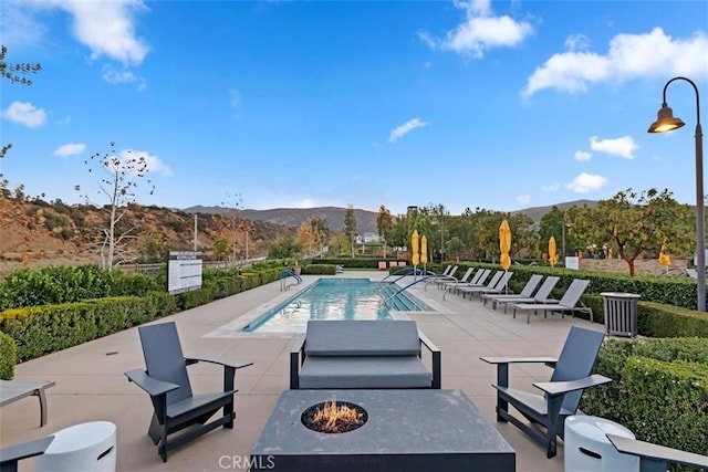 2275 Melogold Way, Corona, CA 92883 - community pool featuring a mountain view, a fire pit, and a patio