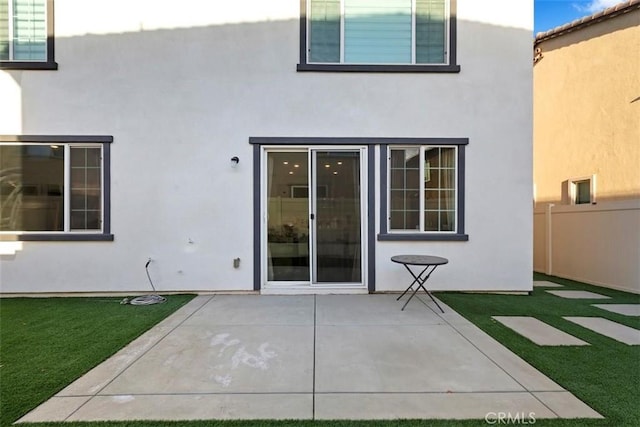 2275 Melogold Way, Corona, CA 92883 - back of house featuring stucco siding and a patio
