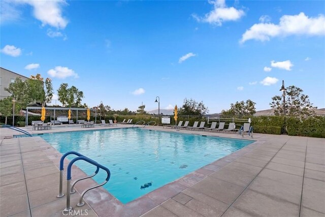 2275 Melogold Way, Corona, CA 92883 - community pool featuring a patio
