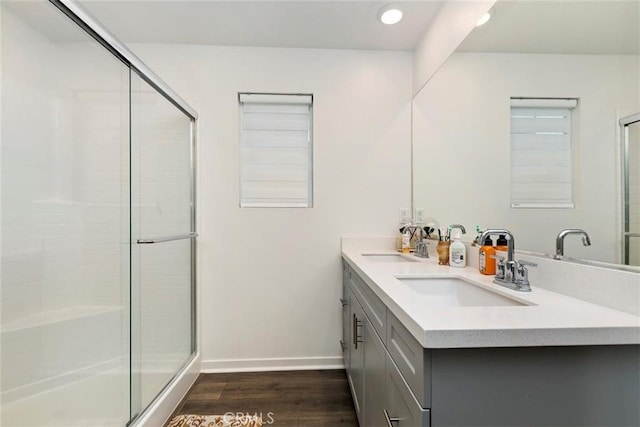 2275 Melogold Way, Corona, CA 92883 - bathroom featuring wood finished floors, a shower stall, double vanity, and recessed lighting