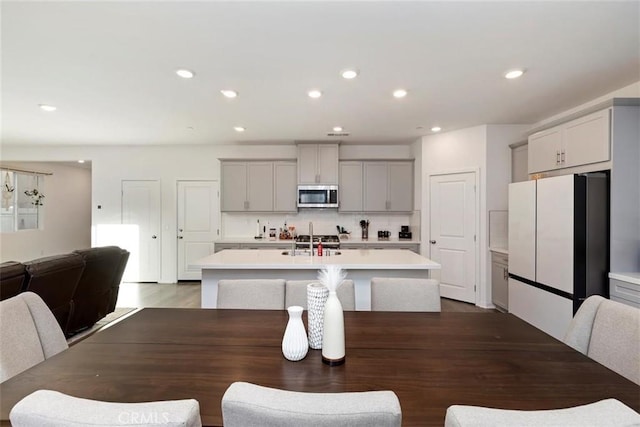 2275 Melogold Way, Corona, CA 92883 - dining area with recessed lighting and dark wood-style flooring