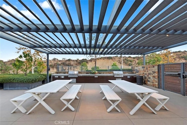 2275 Melogold Way, Corona, CA 92883 - view of patio / terrace featuring outdoor dining area, exterior kitchen, and a pergola
