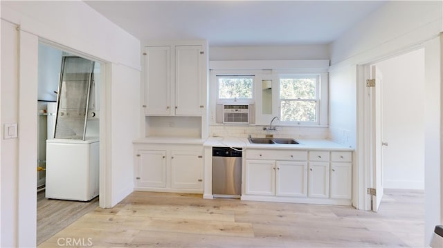 1143 N Sycamore Ave, Los Angeles, CA 90038 - kitchen with stainless steel dishwasher, white cabinets, light countertops, light wood finished floors, and cooling unit