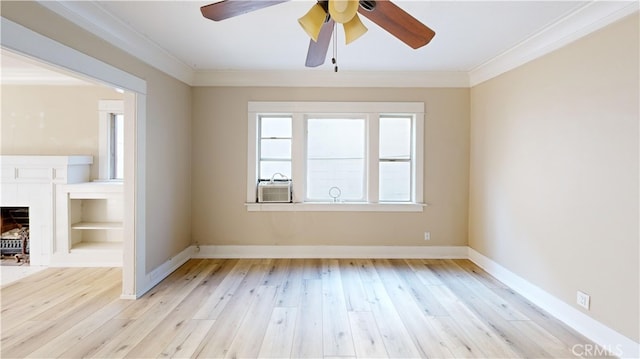 1143 N Sycamore Ave, Los Angeles, CA 90038 - unfurnished living room with ceiling fan, crown molding, light wood finished floors, cooling unit, and a fireplace