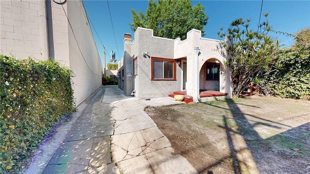 1143 N Sycamore Ave, Los Angeles, CA 90038 - mediterranean / spanish home with stucco siding and concrete driveway