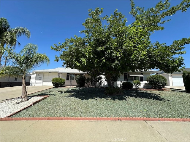 29041 Desert Hills Rd, Menifee, CA 92586 - ranch-style house with driveway, a garage, and a front lawn
