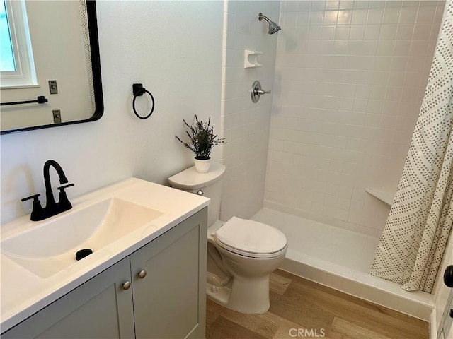 29041 Desert Hills Rd, Menifee, CA 92586 - full bathroom with wood finished floors, vanity, and tiled shower