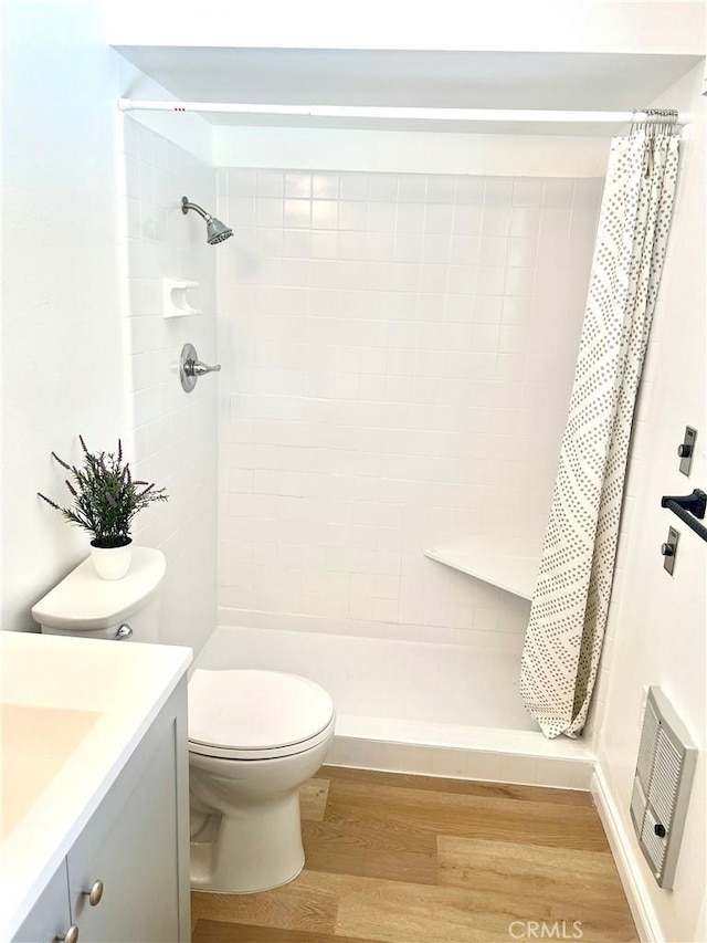 29041 Desert Hills Rd, Menifee, CA 92586 - bathroom featuring vanity, wood finished floors, and a tile shower